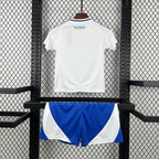 Kids away football kit back view, white jersey and blue-and-white shorts