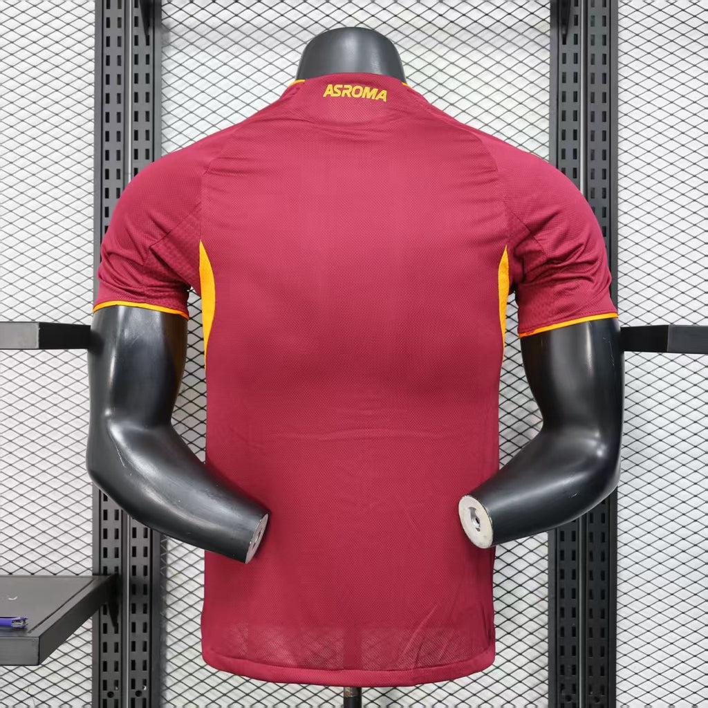 Maroon AS Roma home player jersey back view with yellow trim and neck crest.