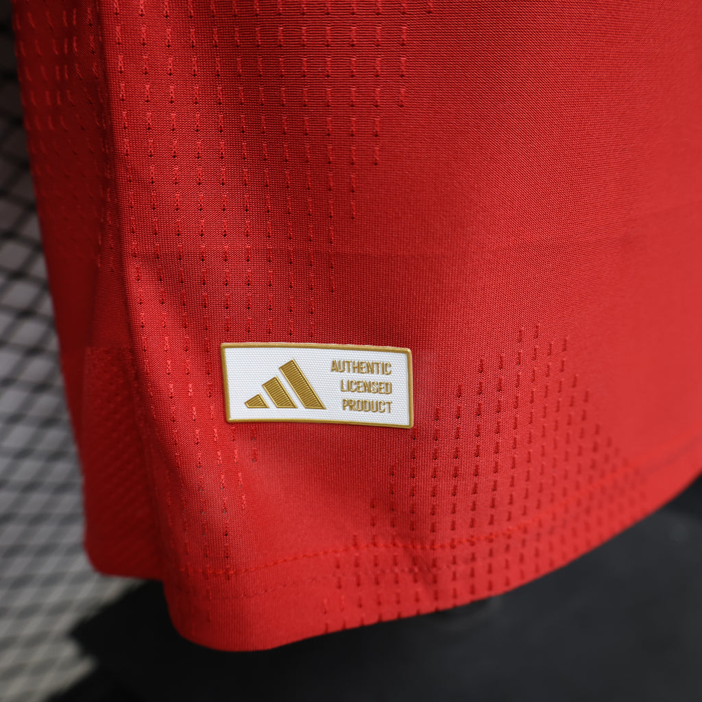 Red shirt tag detail: Authentic Licensed product label