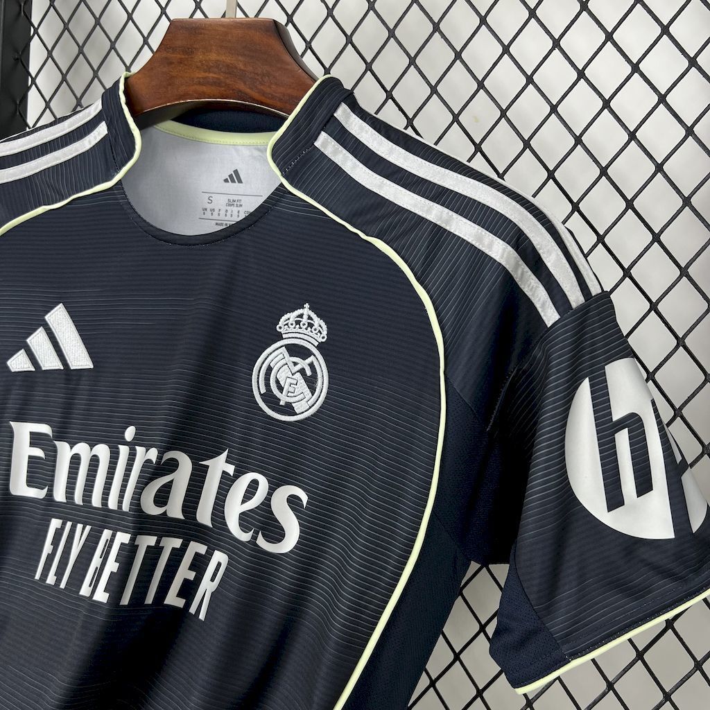 Dark navy Real Madrid away fan jersey close-up with Emirates Fly Better and match number