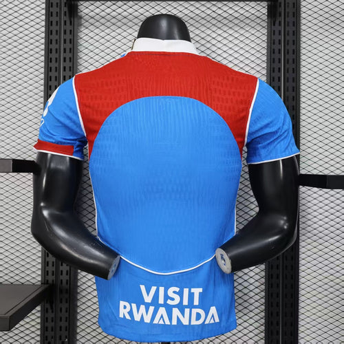 Blue and red third soccer jersey on mannequin, back view with white-trim collar.