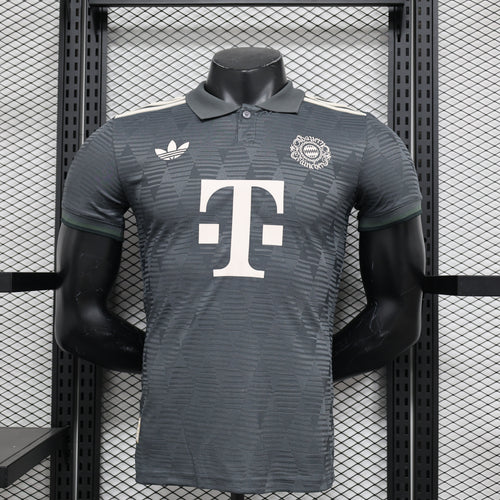 Dark gray football jersey with polo collar, T crest, and sponsor-style badge on chest