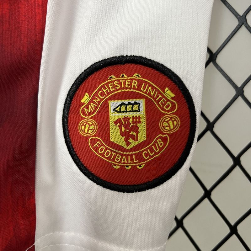 Manchester United round team crest patch on white sleeve