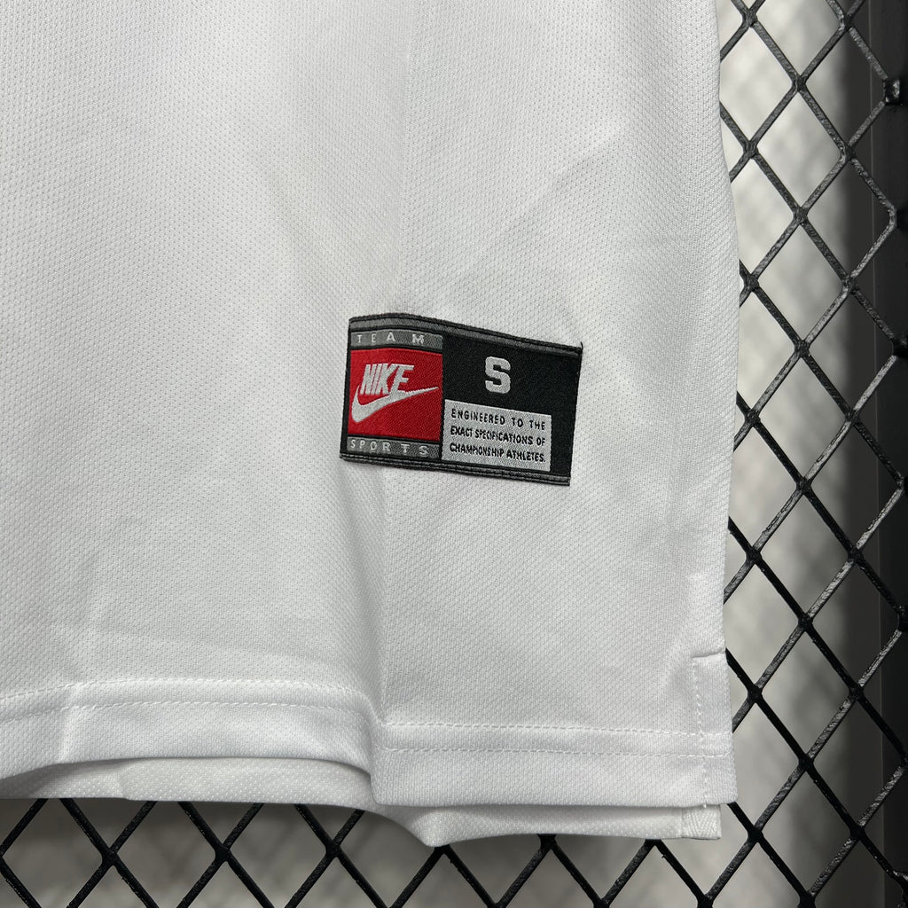 White Nike size S jersey tag on fabric hem