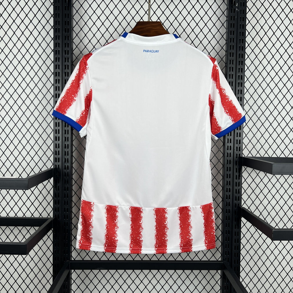 Paraguay home fan soccer jersey back view with red stripe panel at hem and blue trim