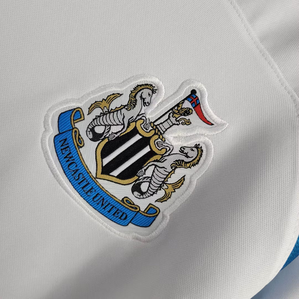 Newcastle crest patch on white retro football jersey fabric