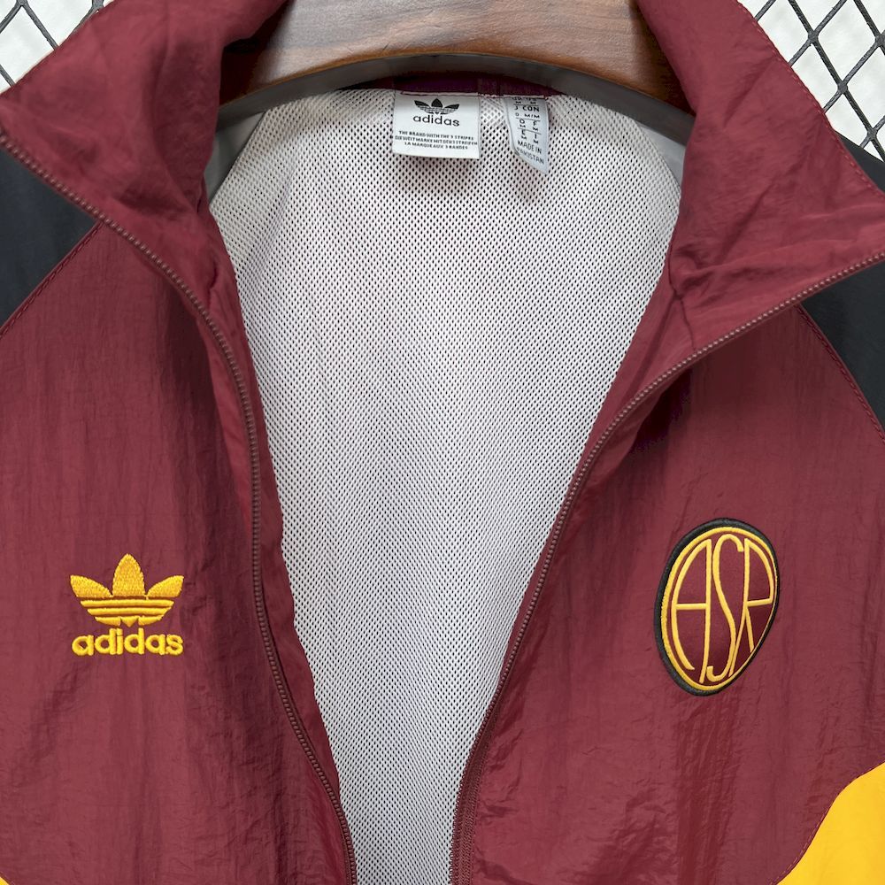 Maroon windbreaker with white mesh lining at collar and adidas logo, zip front.