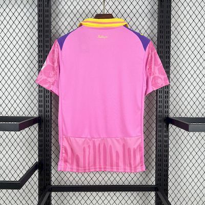 Back view pink goalkeeper jersey with yellow ribbed collar and Evonik sponsor