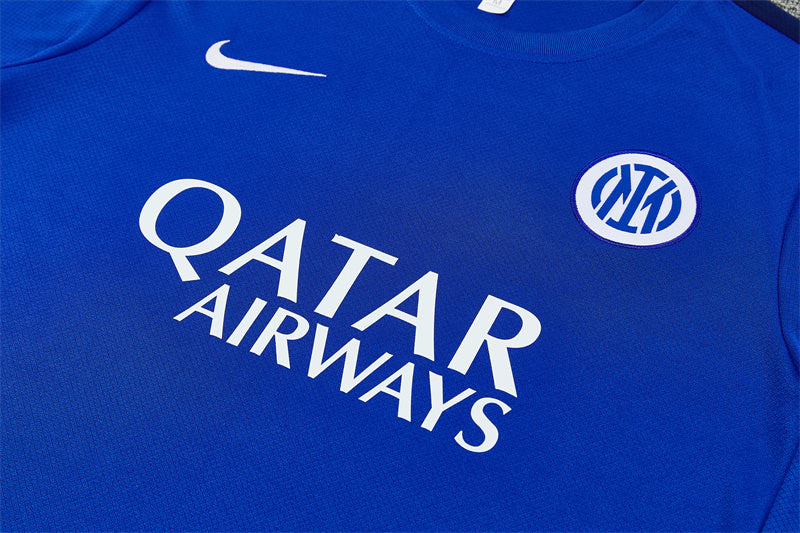 Blue training jersey with Qatar Airways sponsor and Nike swoosh