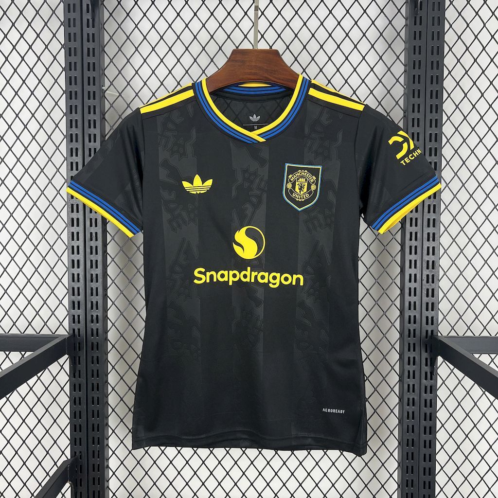 Women's third football jersey, dark with yellow and blue trim, sponsor print.