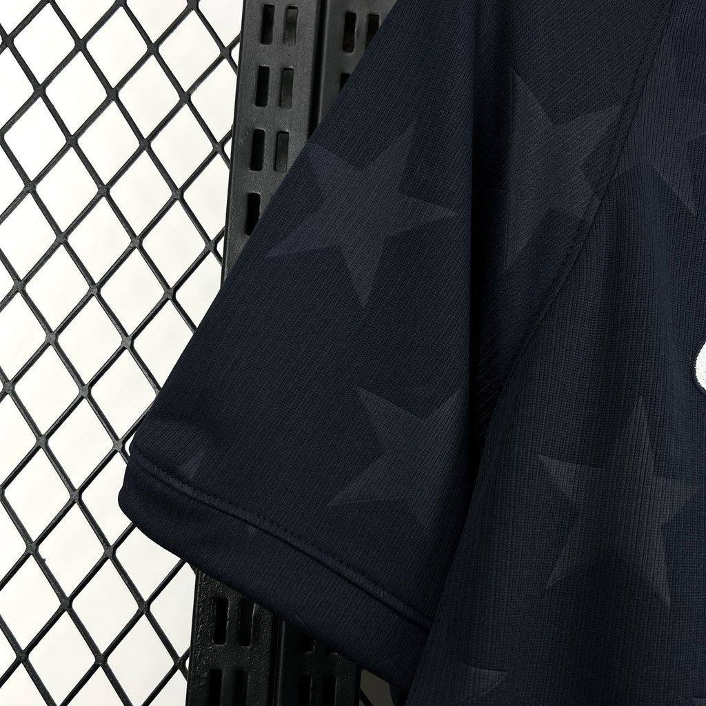 Navy jersey sleeve with subtle star pattern and stitched cuff