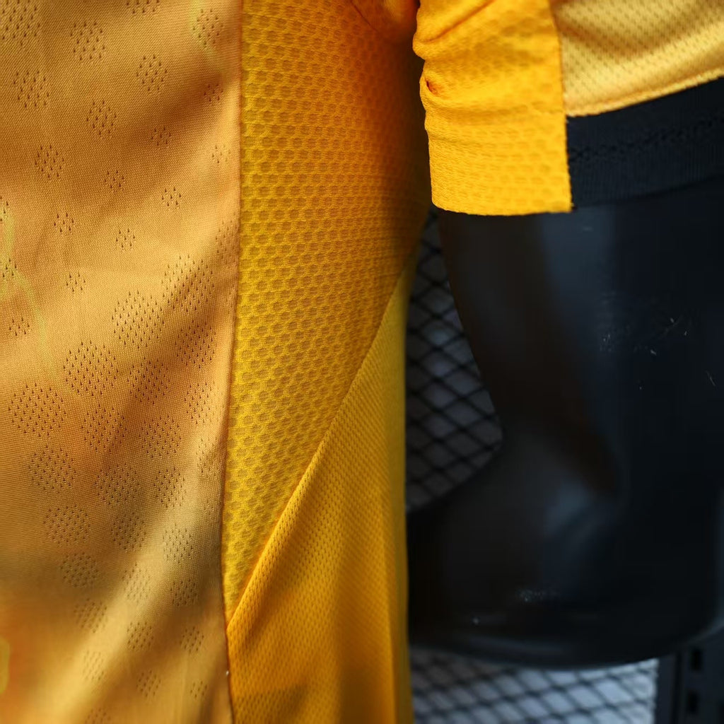 Orange football jersey fabric close-up with textured pattern