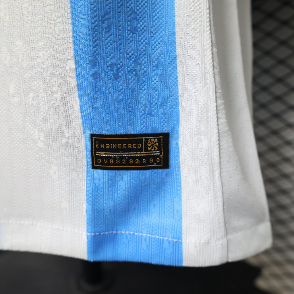 Soccer jersey hem with woven tag and blue vertical stripe