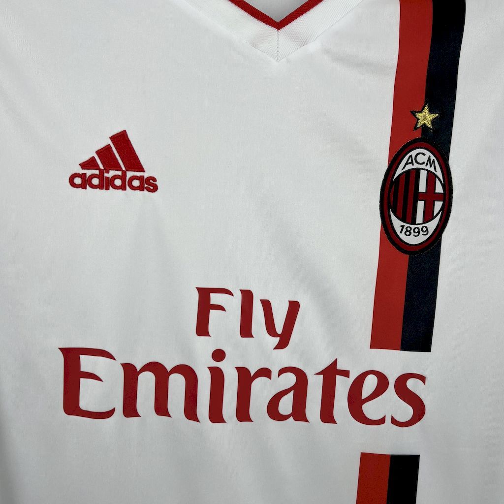 White jersey front with Adidas logo, AC Milan crest, and Fly Emirates text