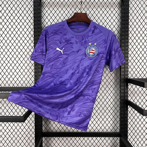 Purple goalkeeper fan jersey with abstract pattern, club crest, gold stars, and Puma logo