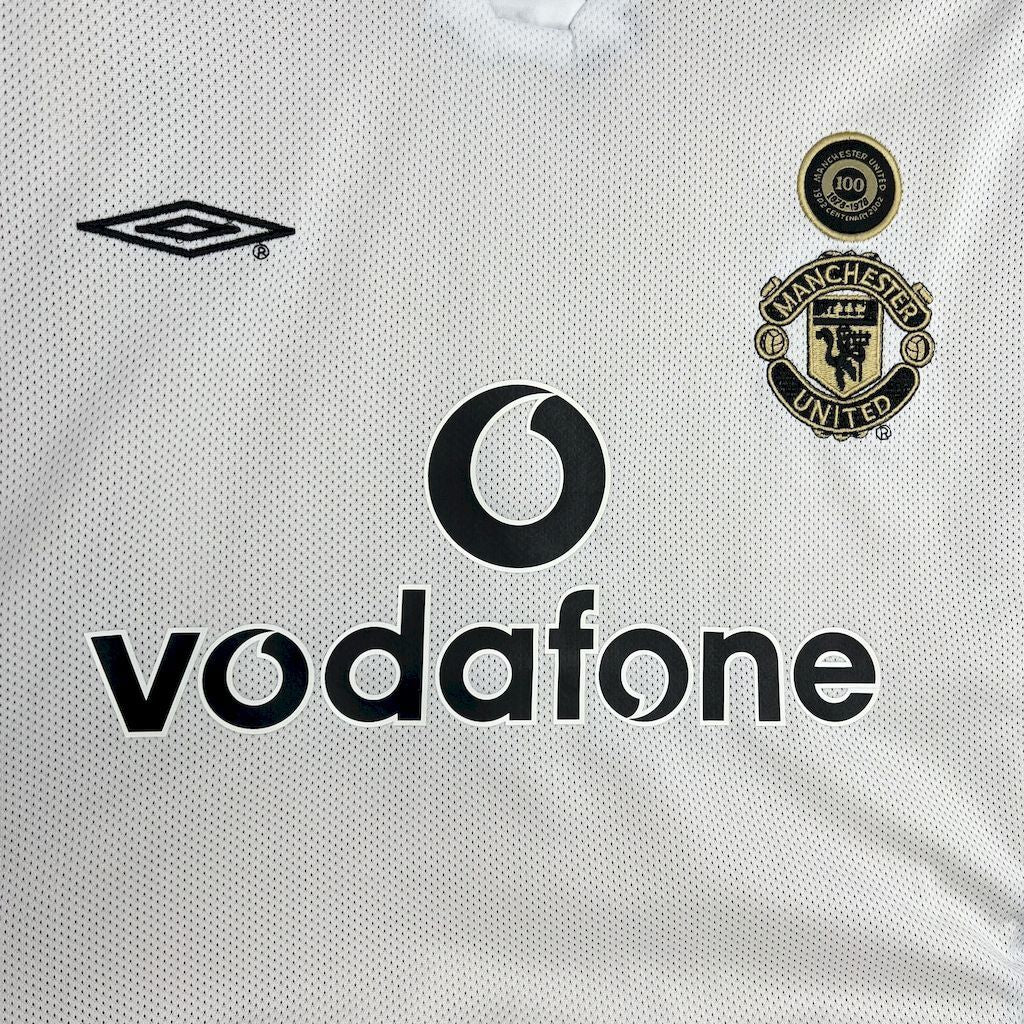 White football jersey with Vodafone sponsor print and Manchester United club crest