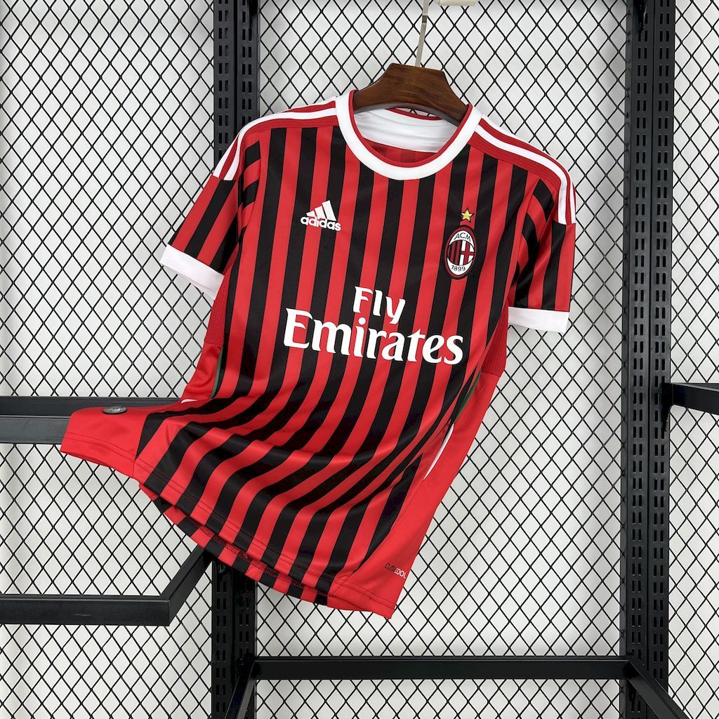 AC Milan home jersey with red-and-black vertical stripes, Emirates sponsor, Adidas logo