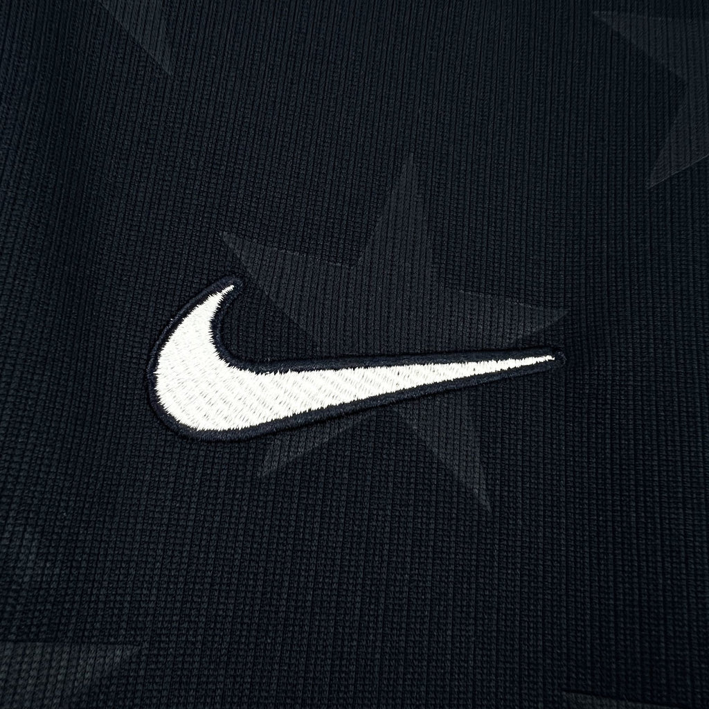 Nike swoosh logo on navy jersey fabric