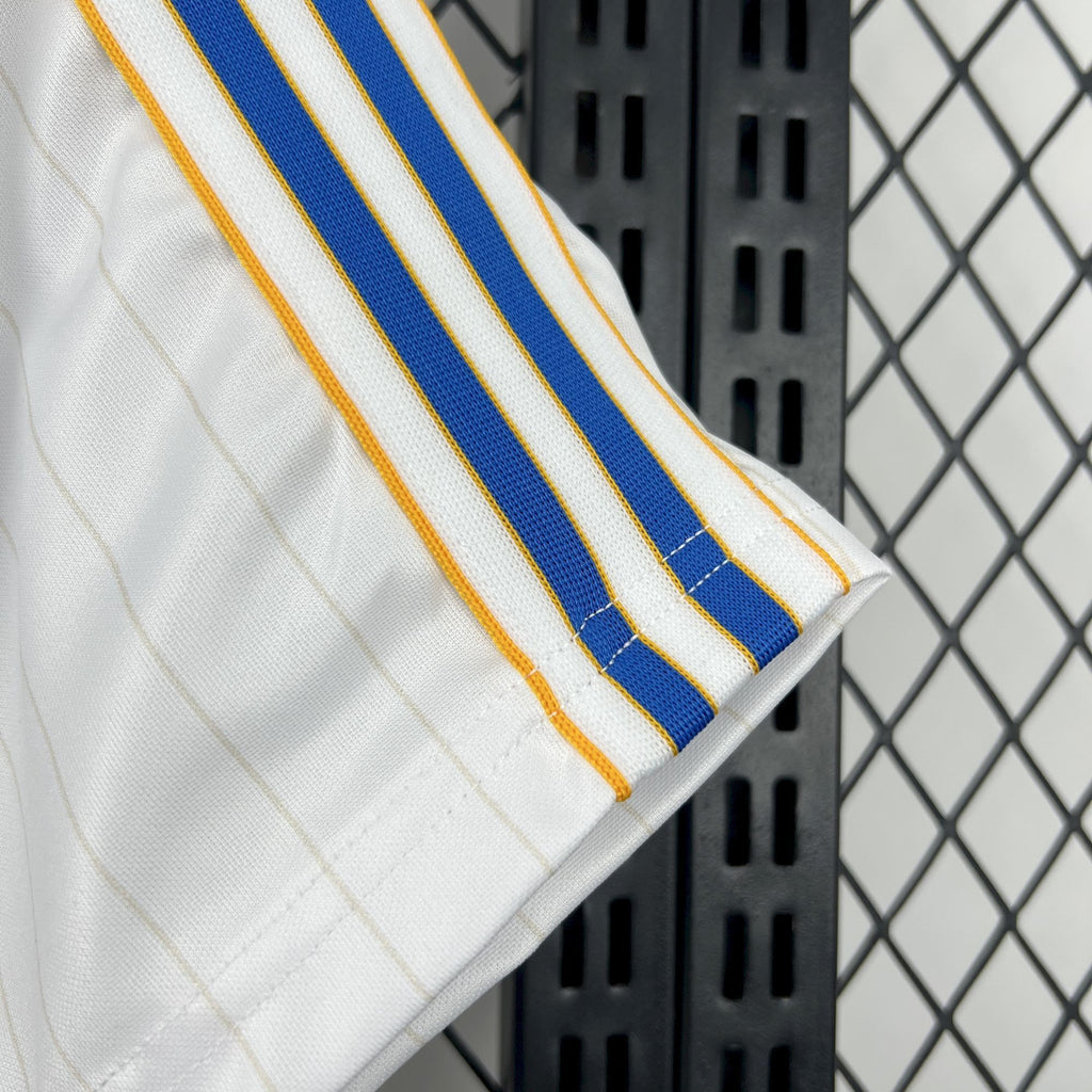 White jersey sleeve with blue center stripe and gold trim