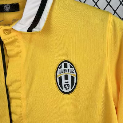 Yellow Juventus football jersey with Juventus crest on chest and black-and-white collar