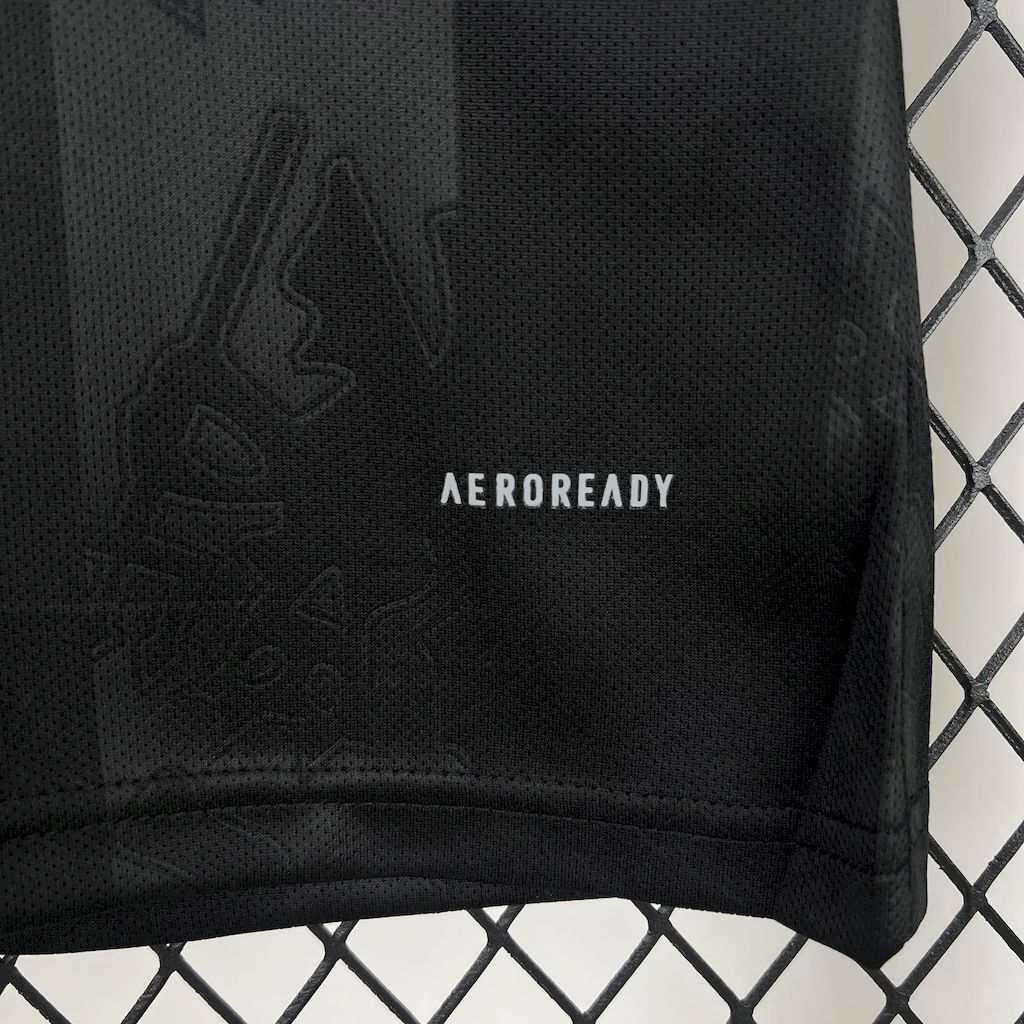 Women's third jersey back hem, 'AEROREADY' logo on dark fabric.