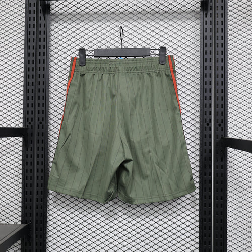 Dark green casual shorts with elastic waistband and red-orange side stripe detailing