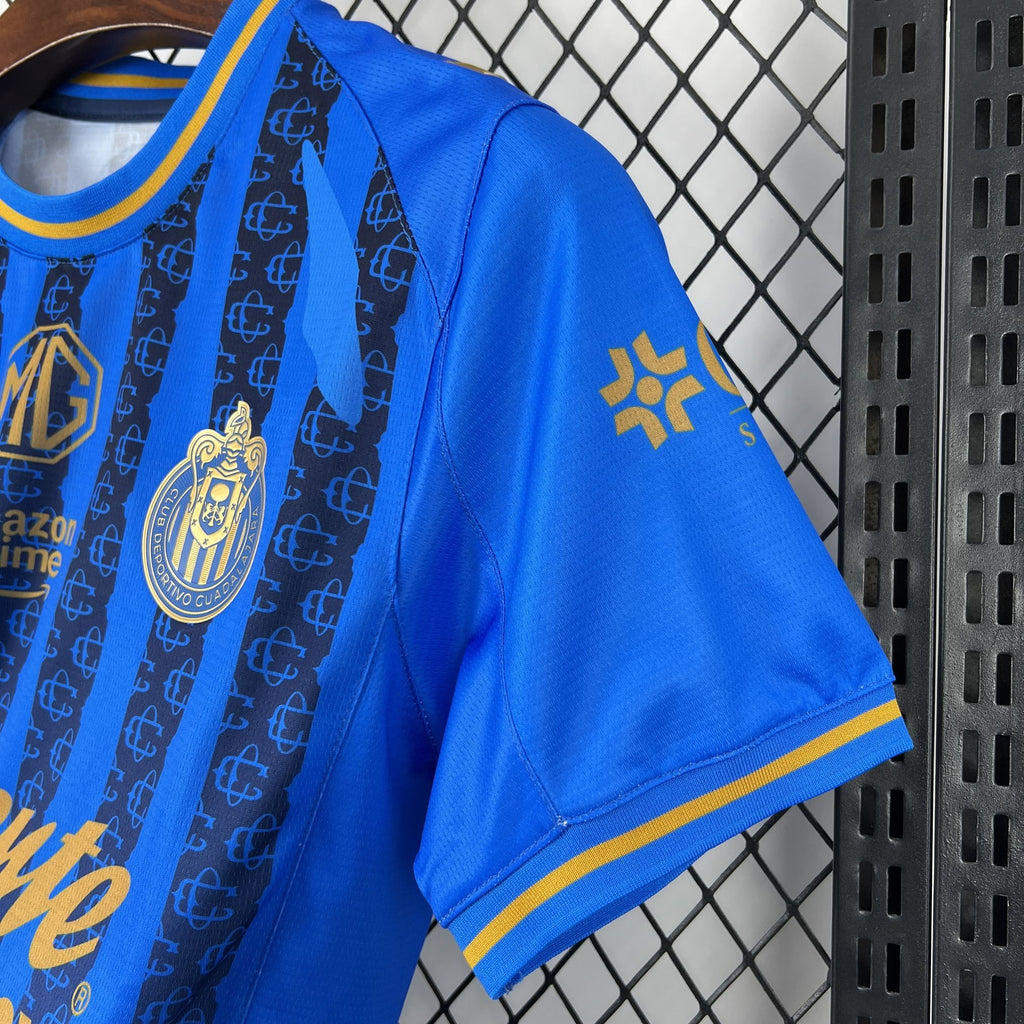 Blue soccer jersey shoulder with gold crest and gold Puma emblem; short sleeve