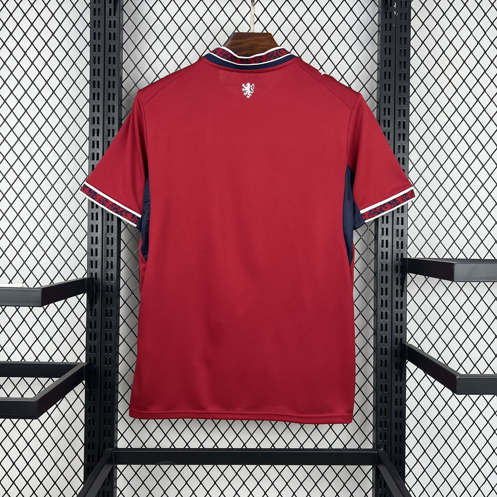 Red soccer jersey with blue-trimmed collar and short sleeves