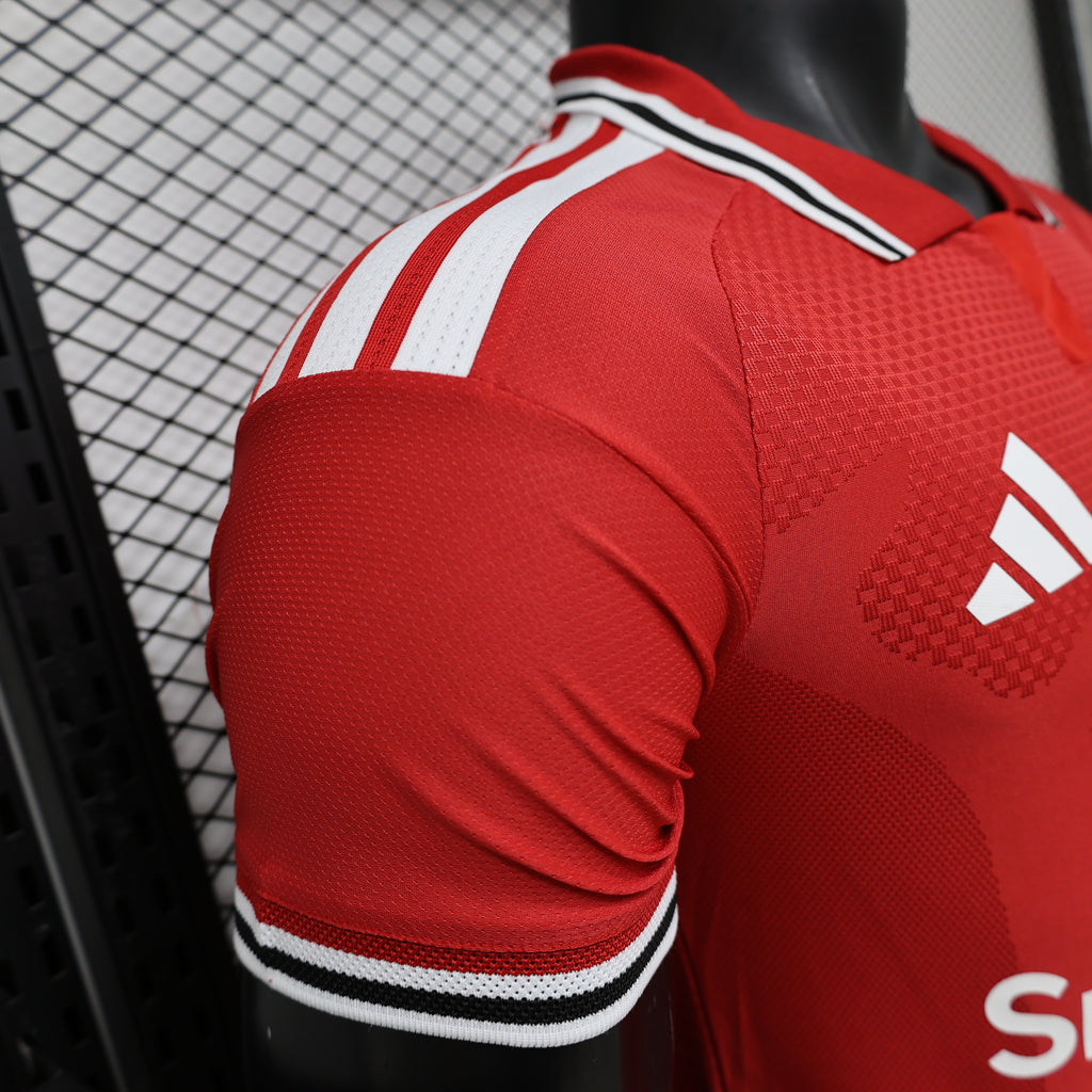 Red football shirt sleeve with white triple stripes and black-trim collar