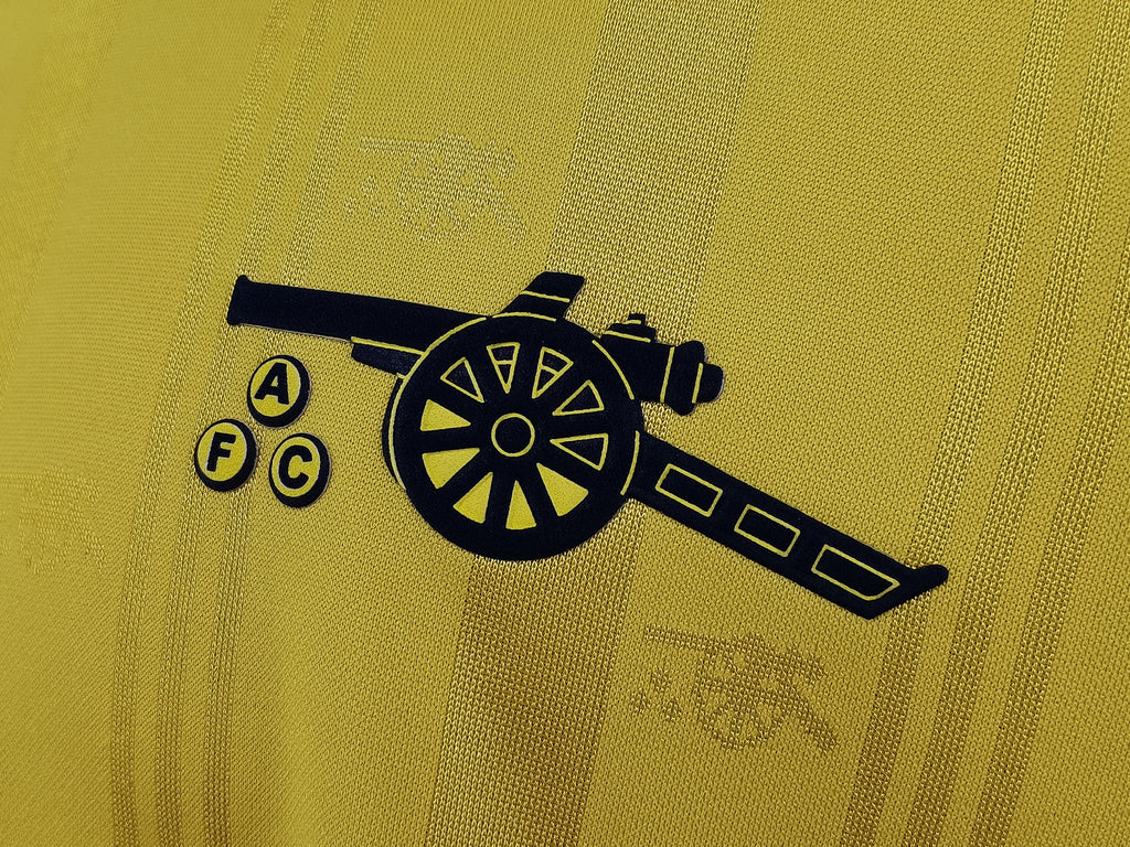 Yellow jersey side logo print with cannon graphic in dark navy
