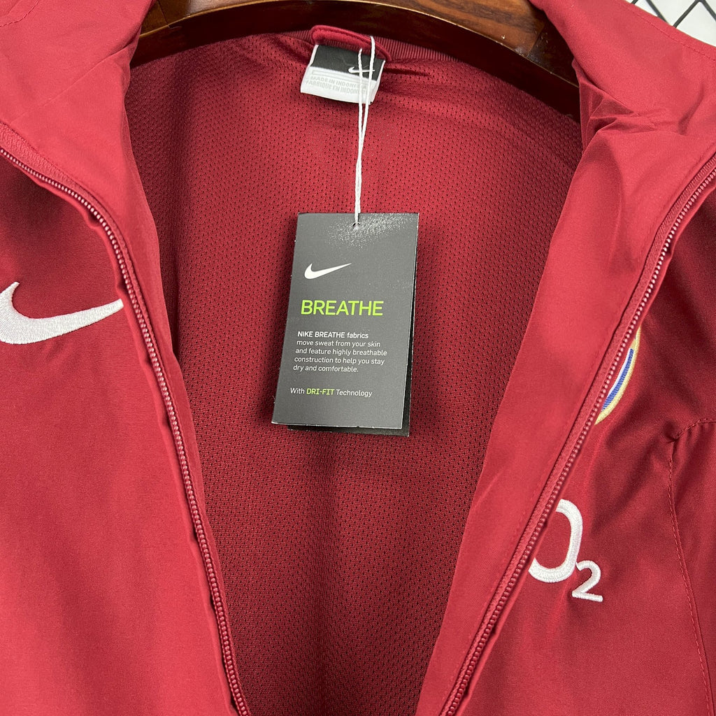 Red windbreaker jacket interior lining with tag and mesh panel
