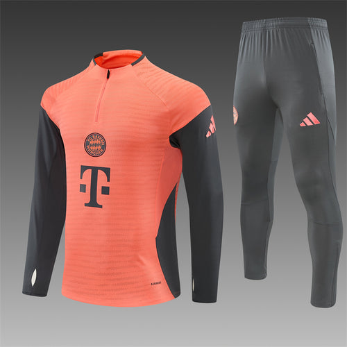 Orange quarter-zip training top with dark gray track pants