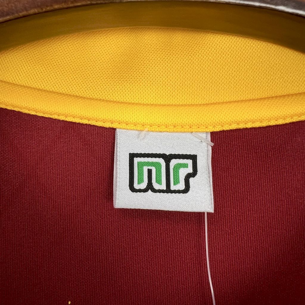 Inside neck label with multicolor mgf logo on maroon jersey