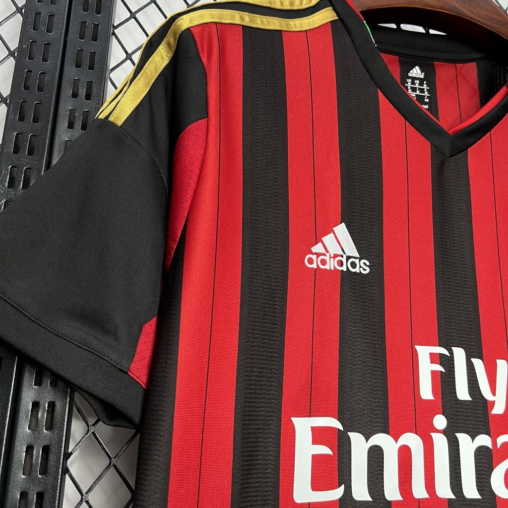 AC Milan home jersey front detail showing adidas logo and Fly Emirates text on stripes