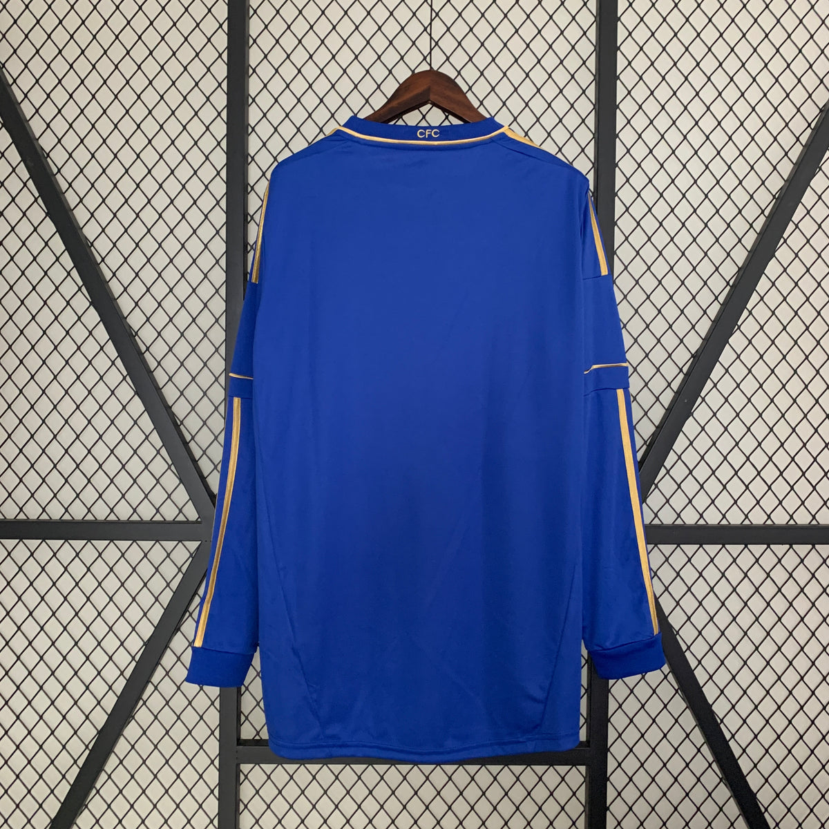 Blue Chelsea home long-sleeve football shirt back view with gold side stripes and CFC collar