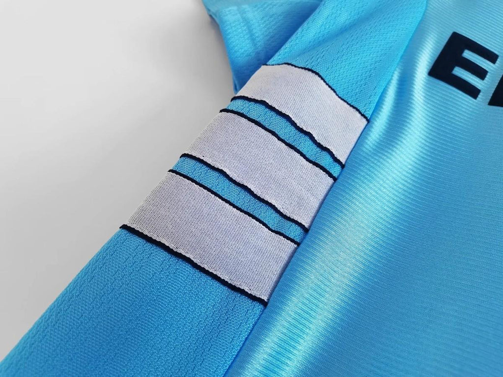 Sky blue sleeve with white and black striped cuff band detail