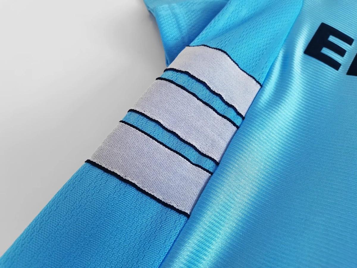 Sky blue sleeve with white and black striped cuff band detail