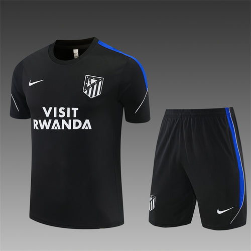 Dark training jersey and shorts set with blue trim, club crest, and VISIT RWANDA print