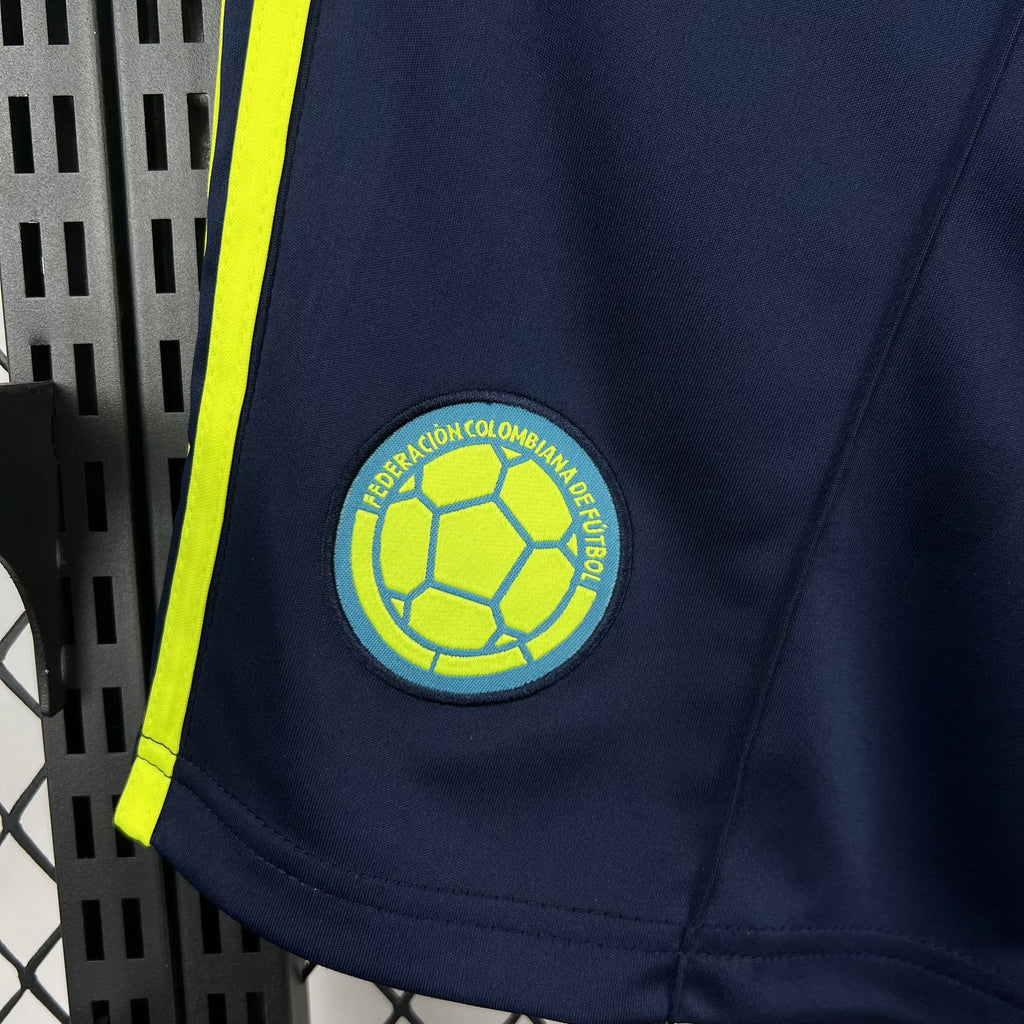 Navy shorts with neon yellow Colombia federation soccer ball crest patch