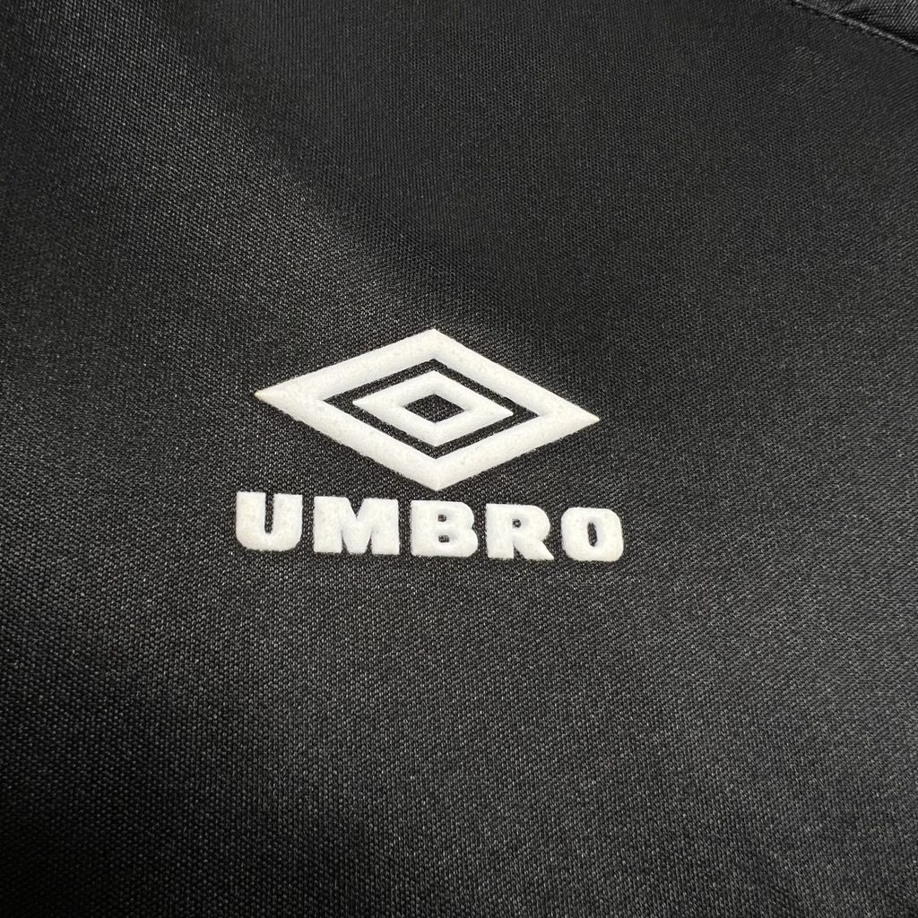 Umbro logo on black soccer jersey fabric