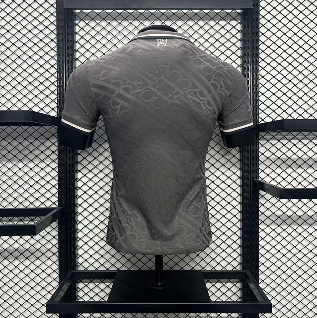 Real Madrid third jersey back view, dark gray with subtle repeating pattern