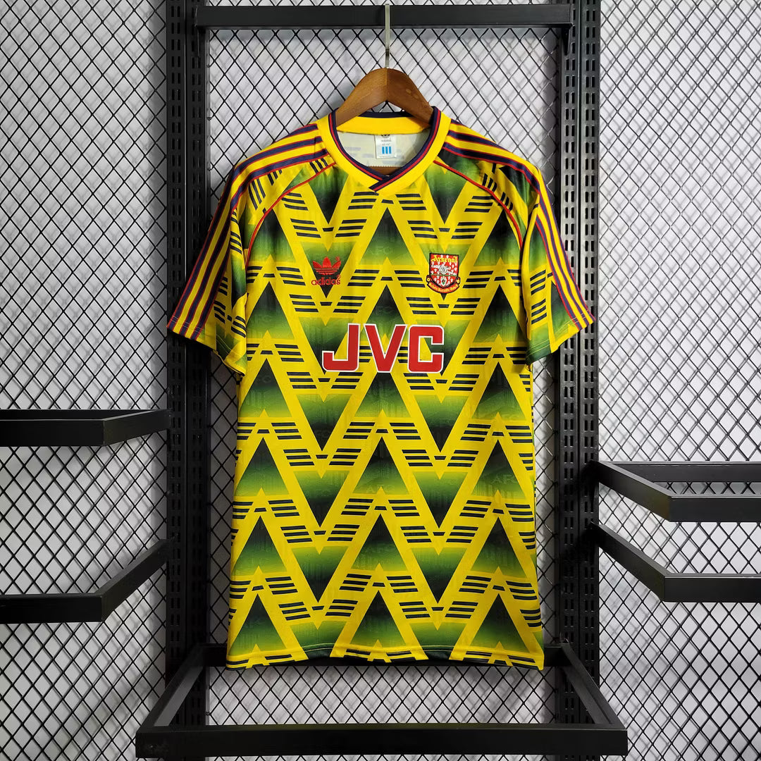 Retro football jersey, yellow-green with zigzag pattern and red sleeve stripes