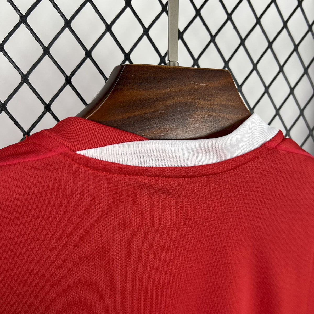 Red Canada soccer jersey neckline with ribbed collar and white inner trim.