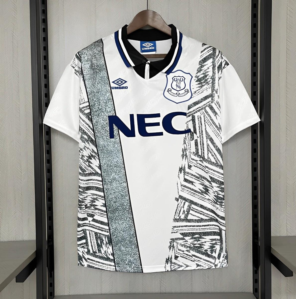 Retro away football jersey, white with black graphic print, blue NEC sponsor and crest