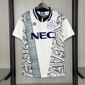 Retro away football jersey, white with black graphic print, blue NEC sponsor and crest