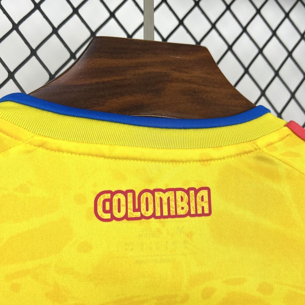 Yellow soccer jersey back with blue-trim collar and red 'Colombia' lettering.