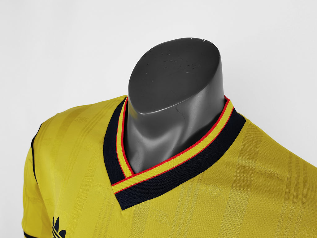 Yellow retro football jersey neckline with navy V-collar and red-and-yellow edge stripes