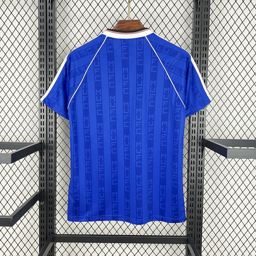 Blue retro football shirt back view with adidas shoulder stripes and V-neck collar