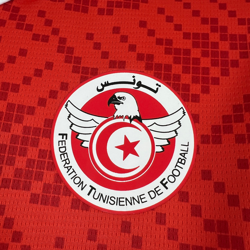 Red jersey front with Federation Tunisienne de Football circular badge