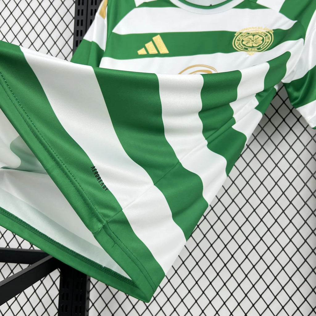 Green and white striped football shirt with adidas logo and sponsor detail on chest